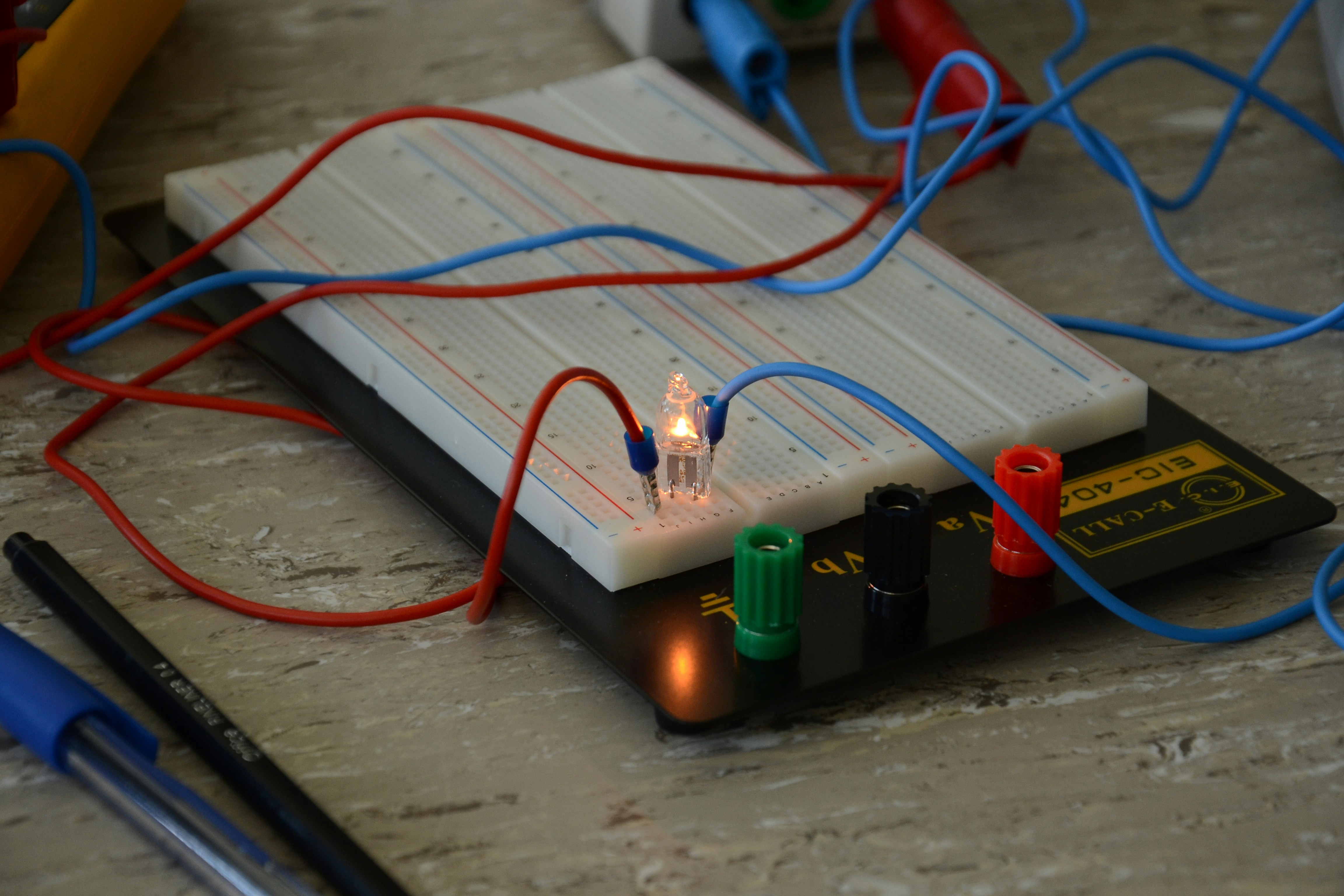 green and orange electric wires