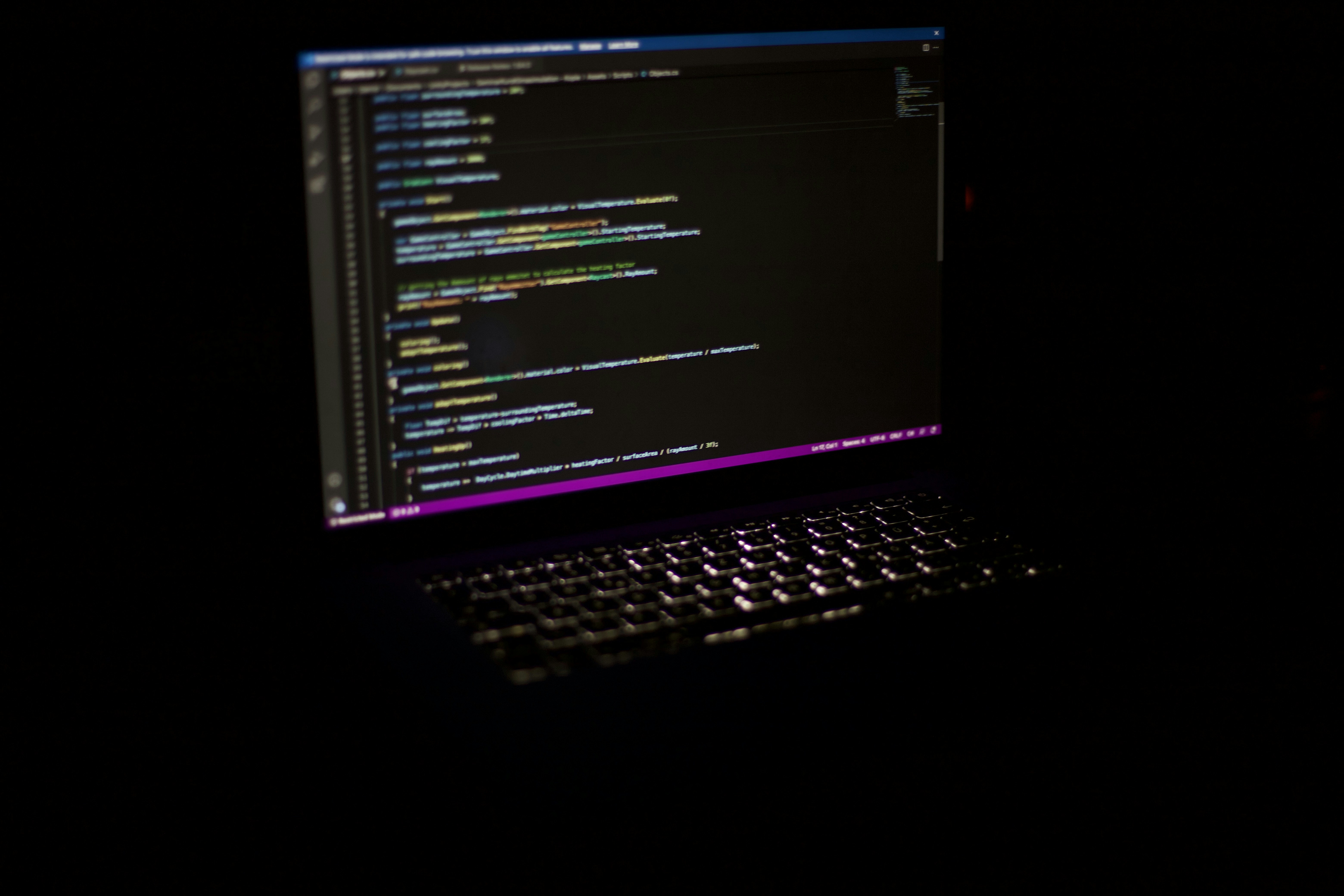a laptop computer sitting on top of a table