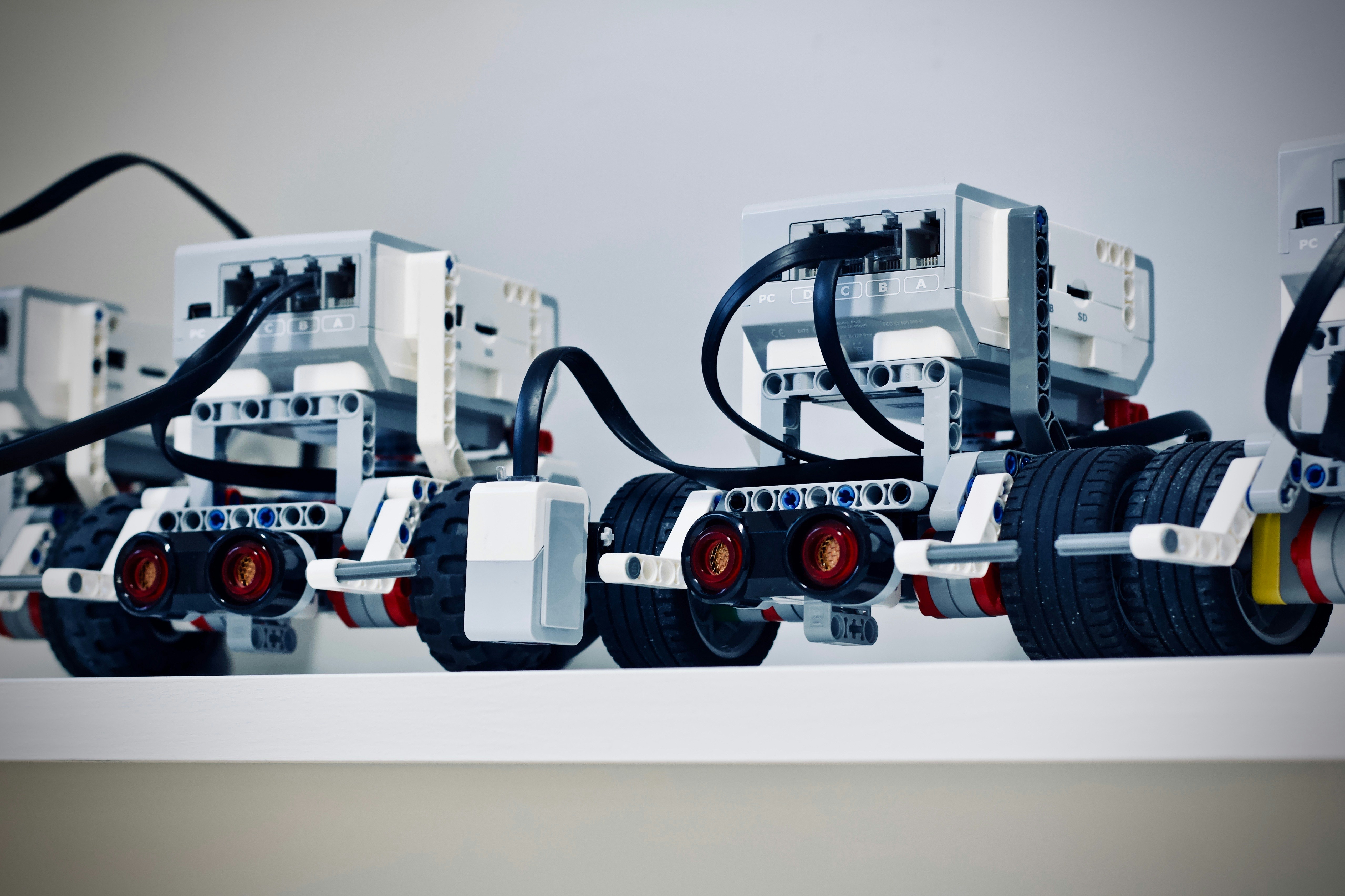 Legobots by Robotic Coding two white and black electronic device with wheels