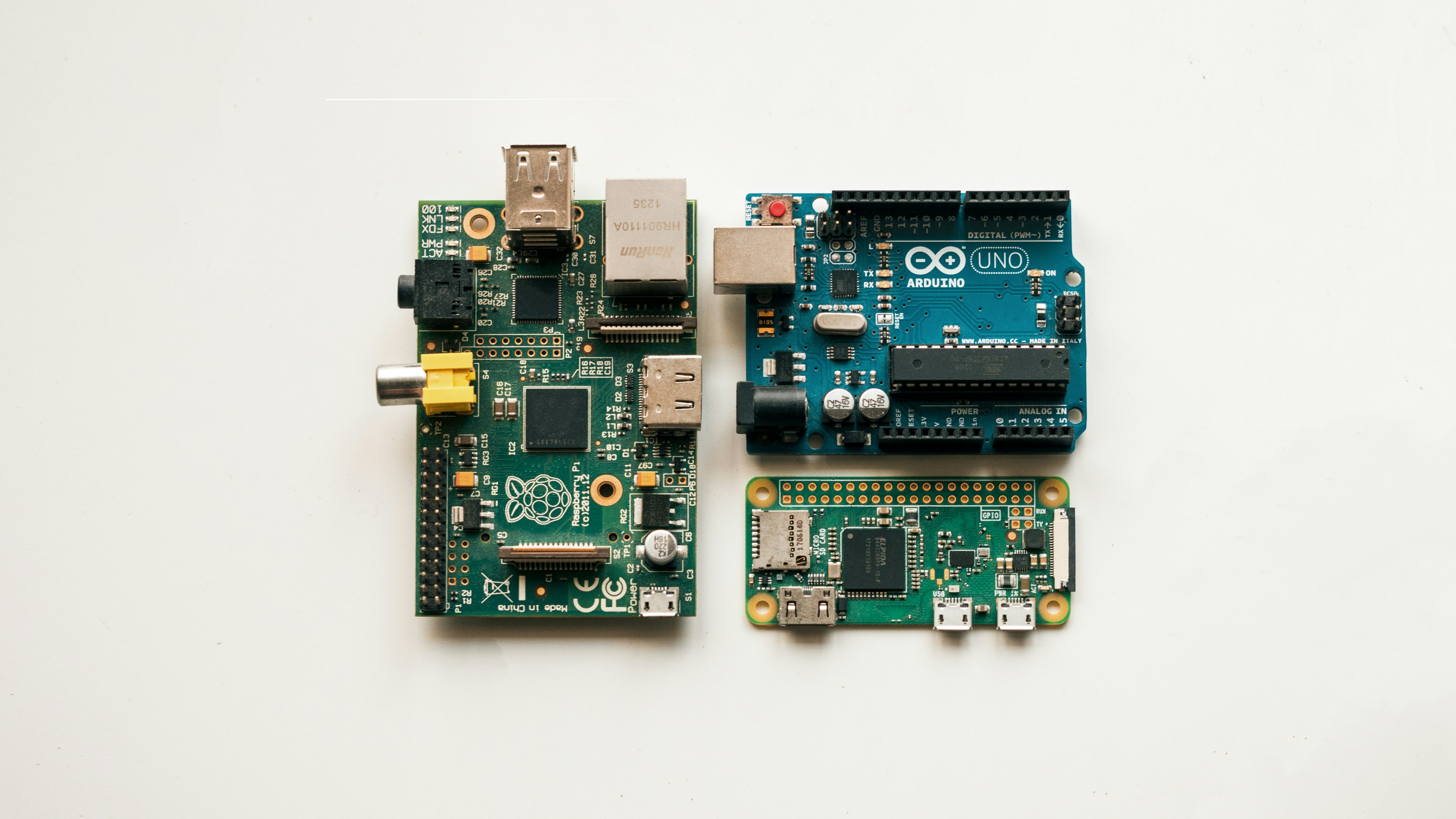 Raspberry pi model b, raspberry pi zero w and Arduino uno development boards by Robotic Coding green and black circuit board