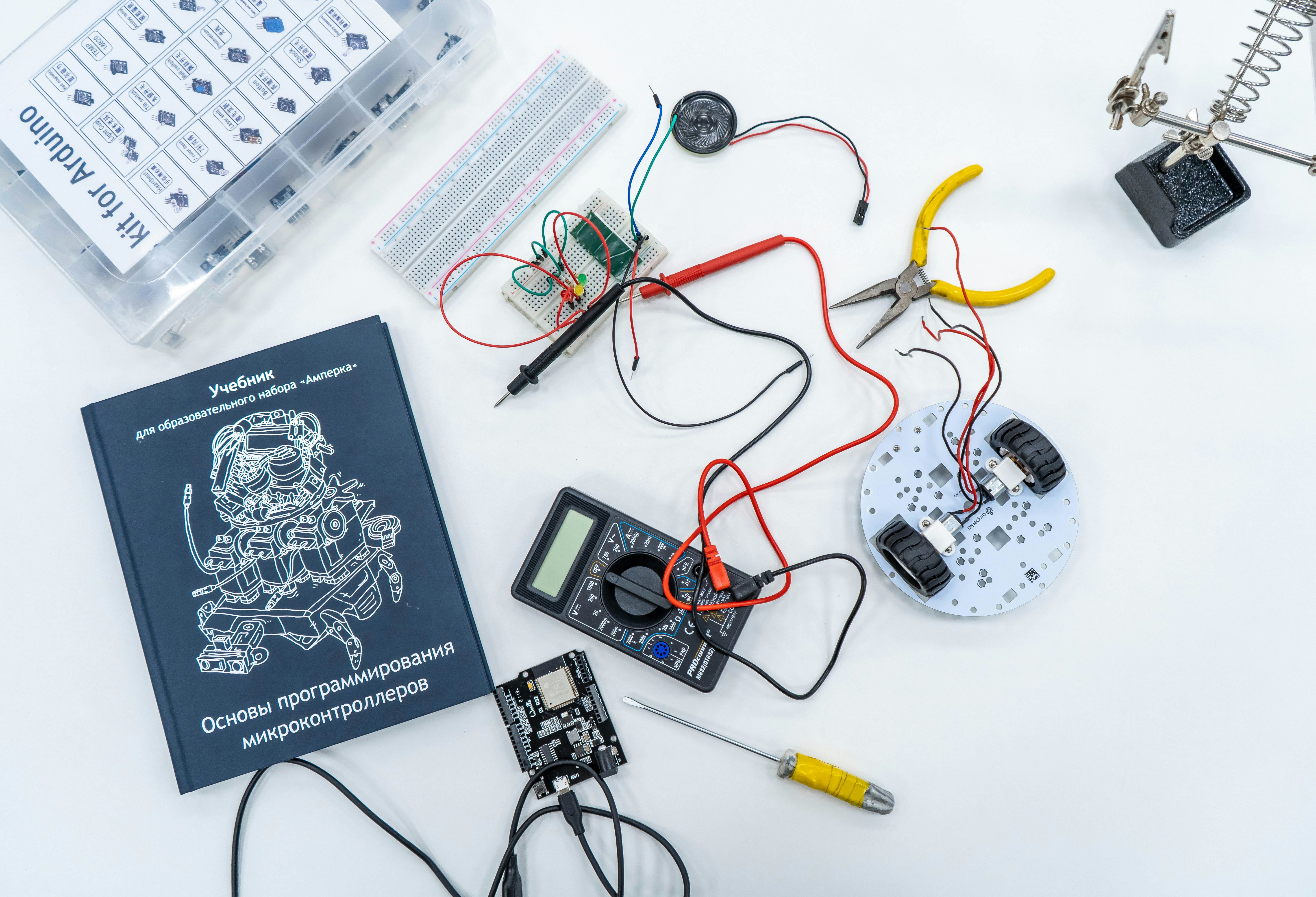 Classroom of the Russian University of Transport by Robotic Coding a book and some electronics on a table