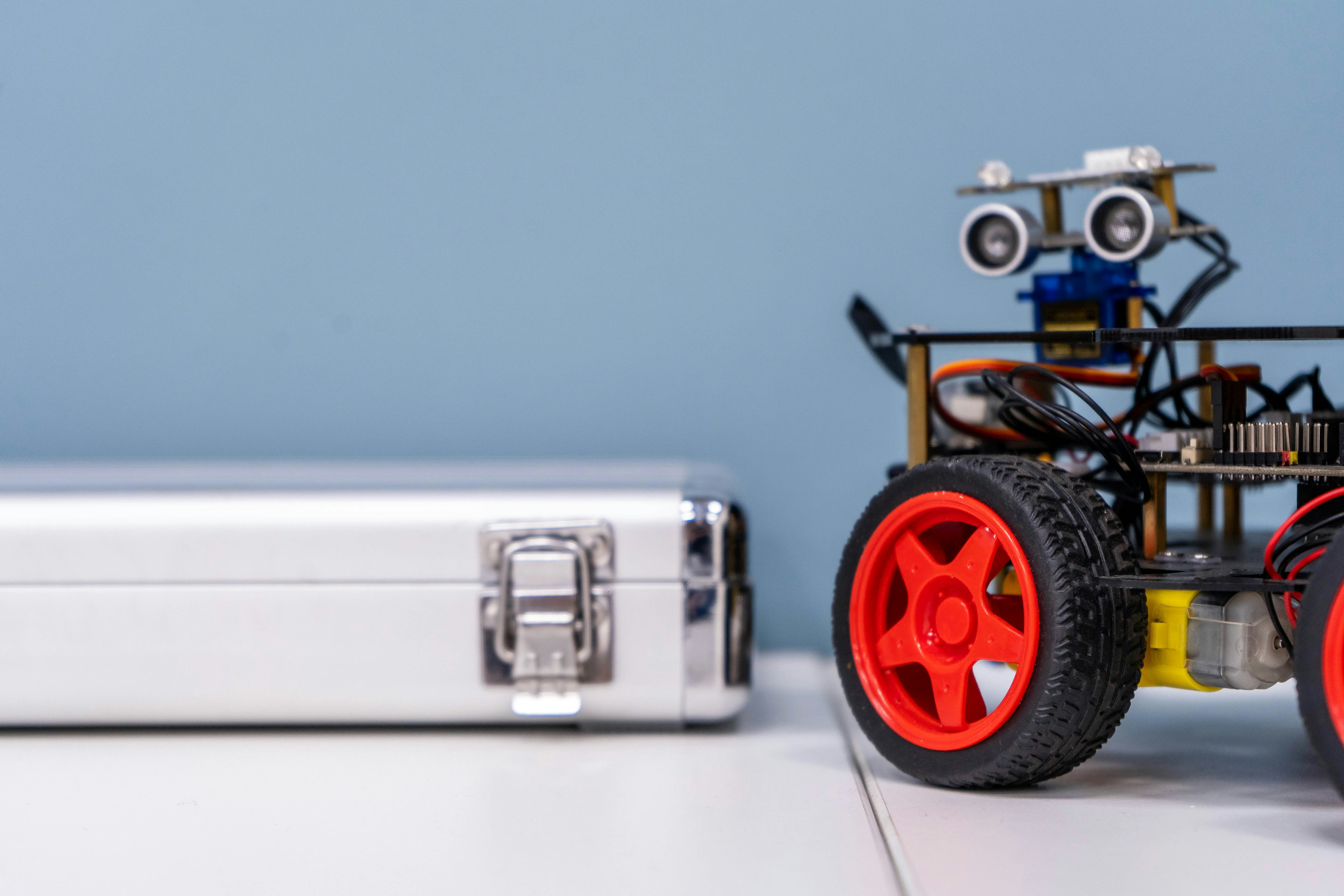 Classroom of the Russian University of Transport by Robotic Coding a toy car sitting next to a metal case