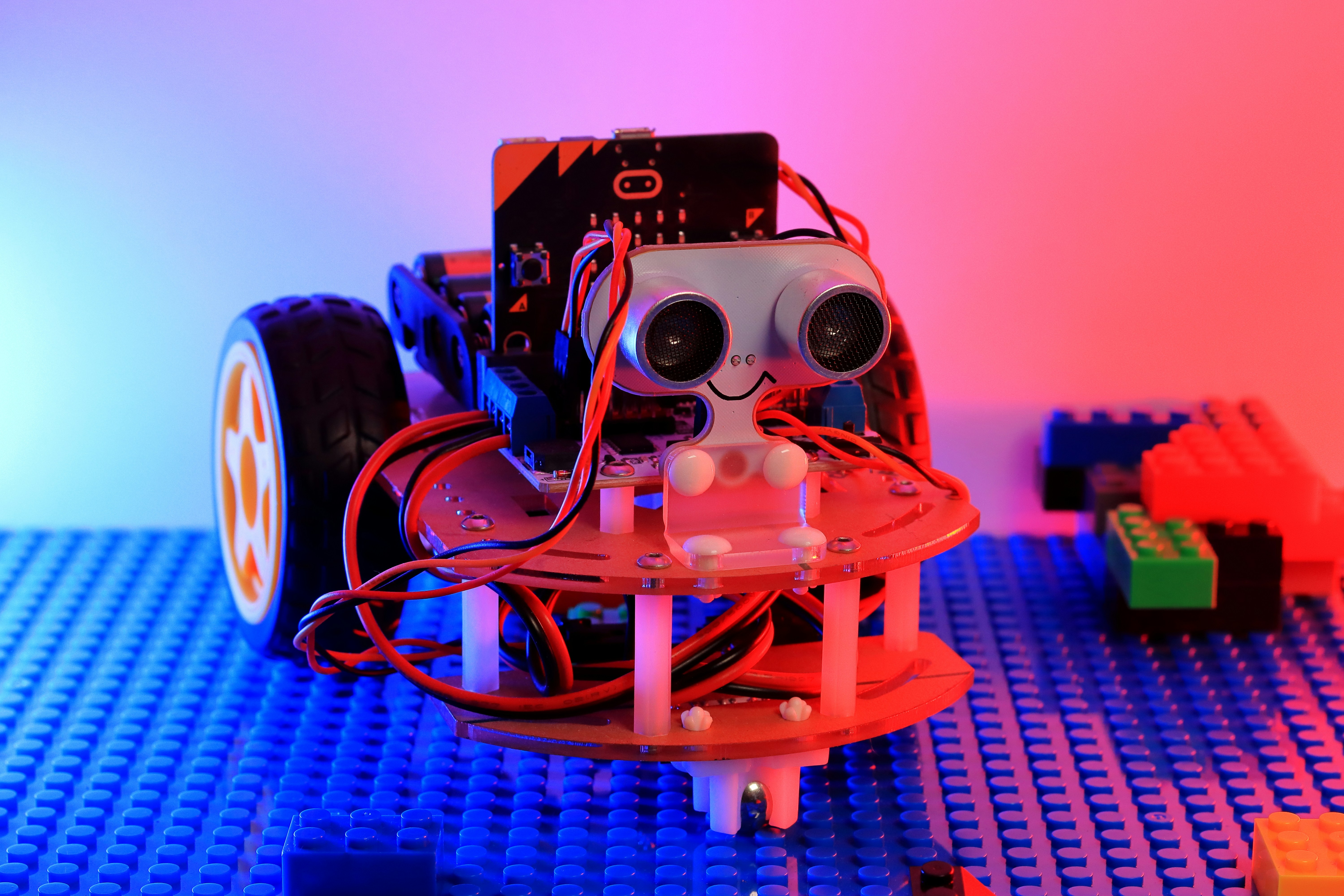 Robot programming stem kit. STEM education. The science. Technology. Engineering by Robotic Coding A robot made out of legos sitting on top of a table