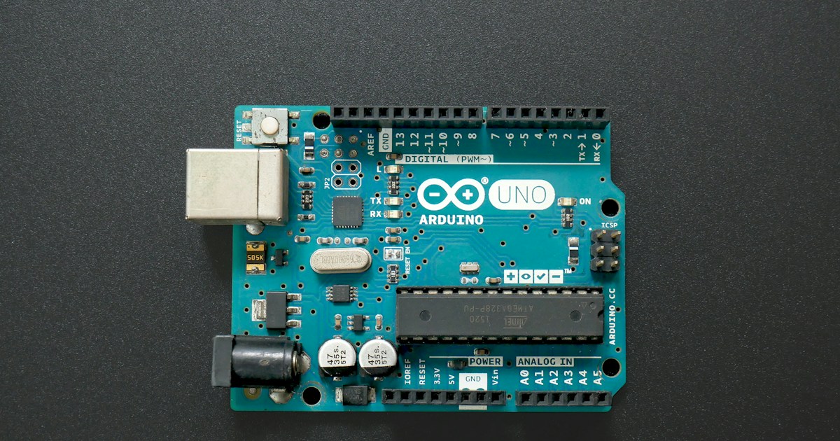 An Arduino Uno board. by Robotic Coding a close up of a small electronic device on a table