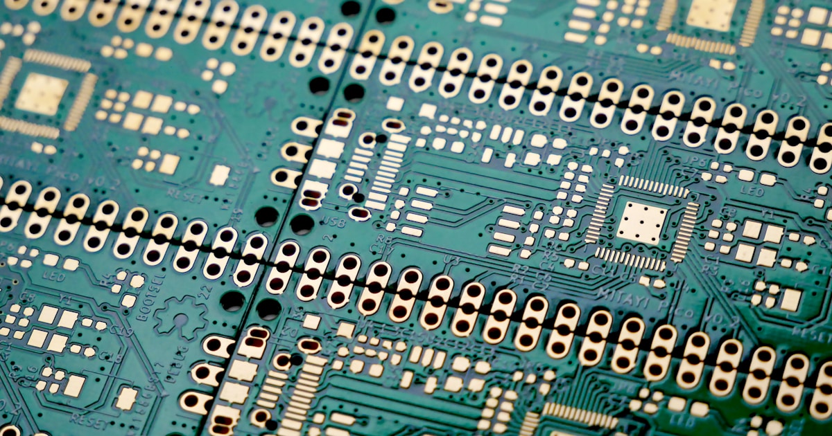 A set of unassembled PCBs with ENIG (Gold Finish). The PCBs are for Mitayi Pico RP1 development board based on Raspberry Pi RP2040 microcontroller. It was designed in KiCad by CIRCUITSTATE Electronics. The project is open source. by Robotic Coding a close up of a printed circuit board